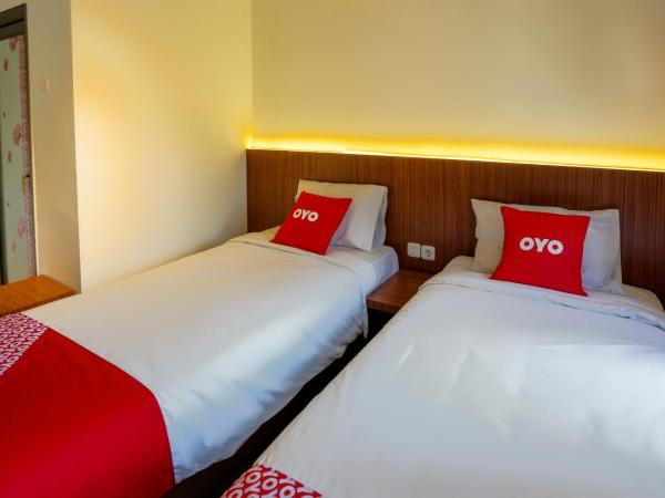 SUPER OYO 3109 Point Inn : photo 3 de la chambre chambre lits jumeaux standard