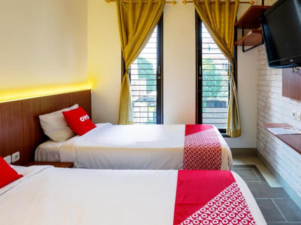 SUPER OYO 3109 Point Inn : photo 5 de la chambre chambre lits jumeaux standard