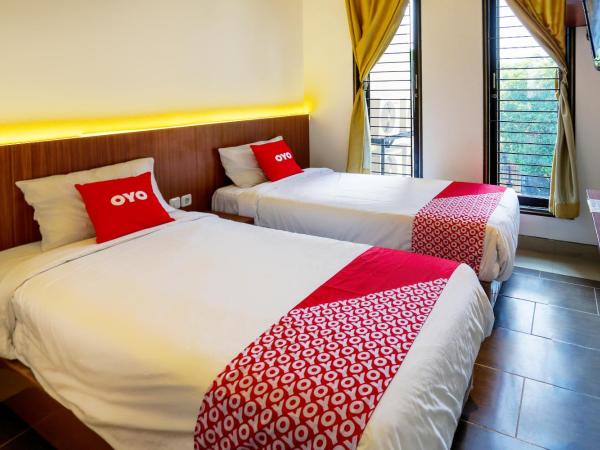 SUPER OYO 3109 Point Inn : photo 2 de la chambre chambre lits jumeaux standard