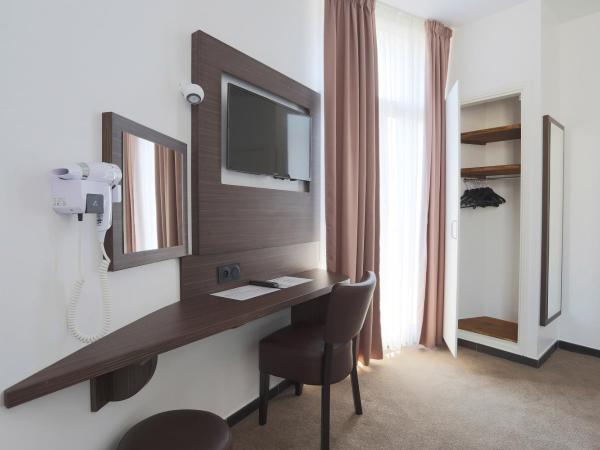 Hôtel & Appartements Monsigny : photo 1 de la chambre chambre lits jumeaux