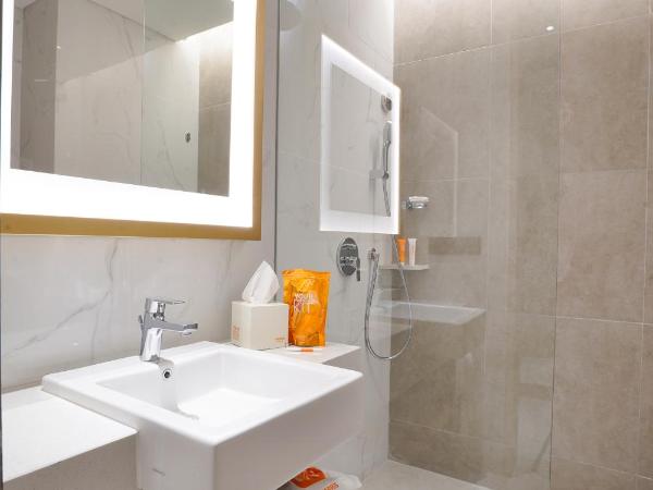 Harris Suites Puri Mansion : photo 5 de la chambre chambre double ou lits jumeaux