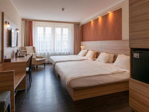 Star G Hotel Premium Dresden Altmarkt : photo 1 de la chambre chambre familiale
