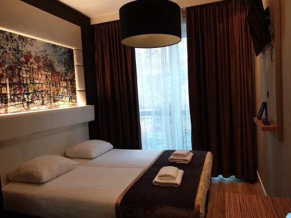 Hotel Mosaic City Centre : photo 2 de la chambre chambre lits jumeaux