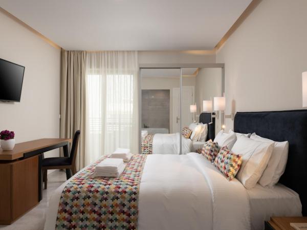 Bio Suites Hotel & Spa : photo 4 de la chambre suite deluxe avec baignoire spa