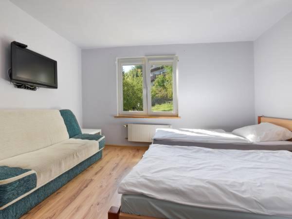 Marynia : photo 3 de la chambre chambre triple avec salle de bains privative