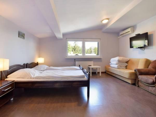 Marynia : photo 2 de la chambre chambre quadruple avec salle de bains