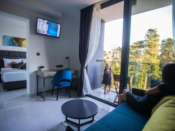 LIBERTY PLAZA : photo 1 de la chambre chambre double deluxe avec balcon