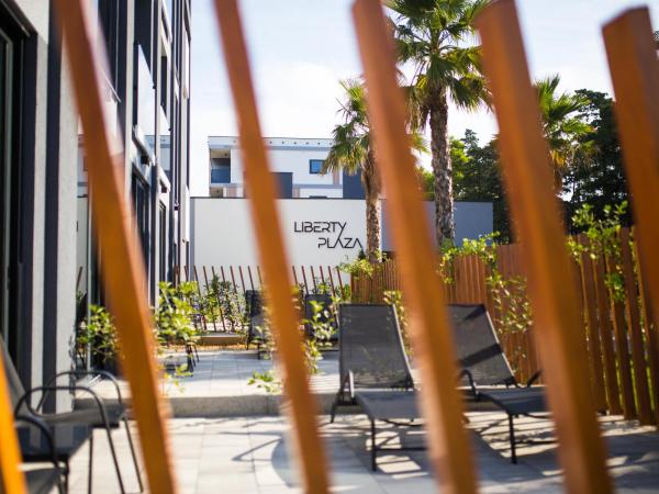 LIBERTY PLAZA : photo 5 de la chambre chambre double deluxe avec balcon