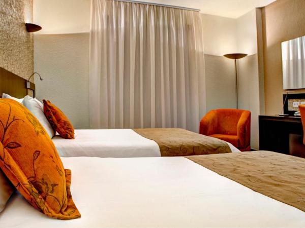 Quality Hotel Curitiba : photo 2 de la chambre chambre lits jumeaux deluxe
