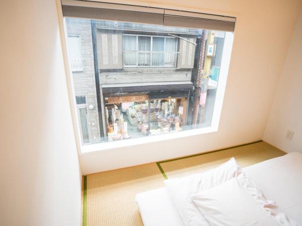 Sato-san's Rest : photo 1 de la chambre chambre triple avec salle de bains commune