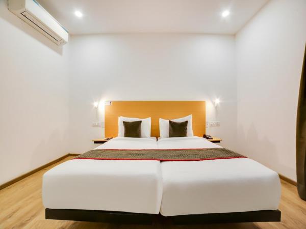 Flora Residency : photo 3 de la chambre chambre double ou lits jumeaux