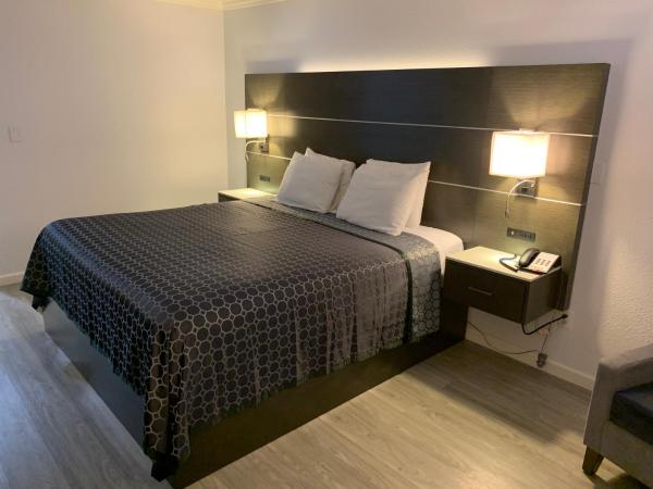 Mirage Inn & Suites : photo 2 de la chambre chambre lit king-size standard