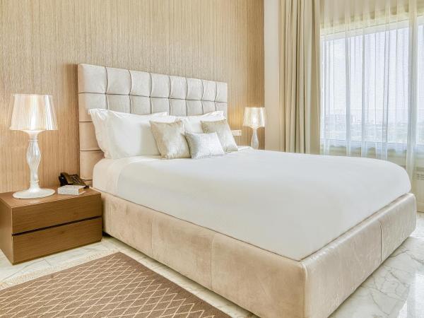 ADAM Hotel Suites : photo 1 de la chambre suite deluxe lit king-size - vue sur lac