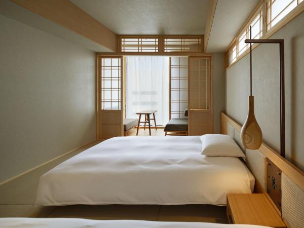 ONSEN RYOKAN Yuen Sapporo : photo 1 de la chambre chambre lits jumeaux d'angle avec douche - non-fumeurs