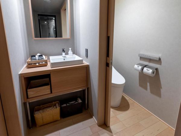 ONSEN RYOKAN Yuen Sapporo : photo 2 de la chambre chambre lits jumeaux d'angle avec douche - non-fumeurs