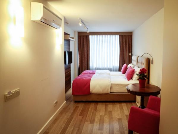 Melek Hotels Moda : photo 1 de la chambre chambre deluxe double ou lits jumeaux