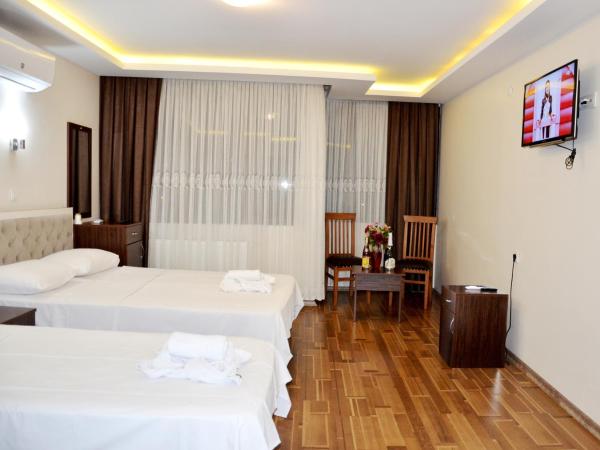 Hotel Grand Mark : photo 2 de la chambre chambre triple standard