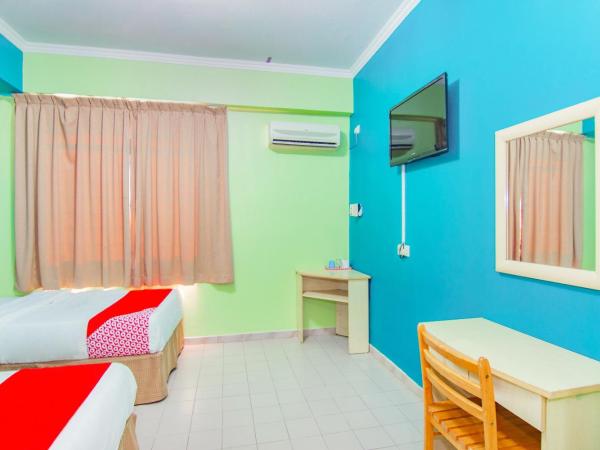 Super OYO 1159 Hotel New Sabah : photo 4 de la chambre chambre lits jumeaux standard