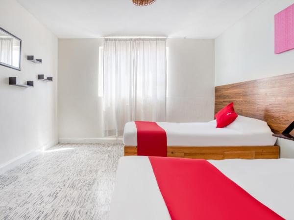 Hotel Suites Puebla : photo 5 de la chambre hébergement quadruple standard