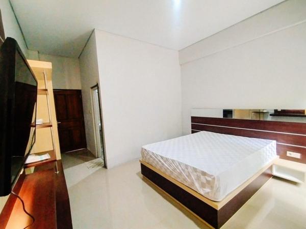 RedDoorz At Artomoro Guest House : photo 1 de la chambre chambre deluxe