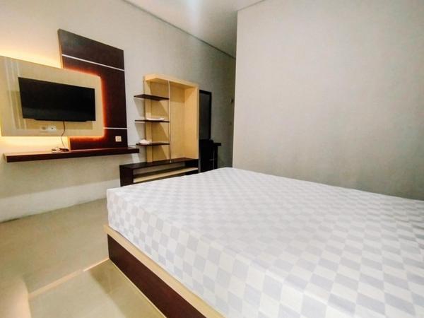 RedDoorz At Artomoro Guest House : photo 4 de la chambre chambre deluxe