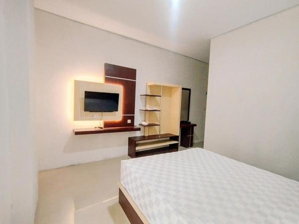 RedDoorz At Artomoro Guest House : photo 3 de la chambre chambre deluxe