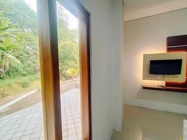 RedDoorz At Artomoro Guest House : photo 2 de la chambre chambre deluxe