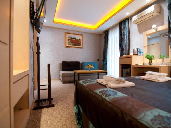 Grand Ambiance Hotel : photo 3 de la chambre chambre familiale deluxe