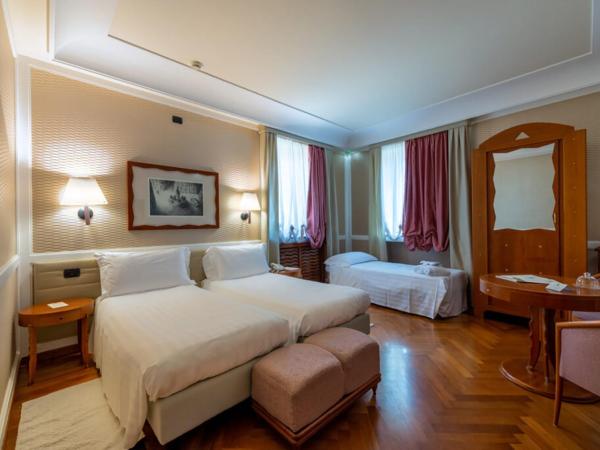 Grand Hotel Ortigia : photo 1 de la chambre chambre triple deluxe - vue sur mer