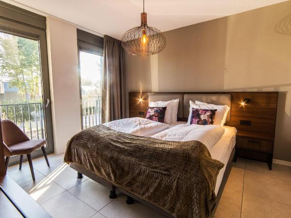 Dormio Resort Maastricht : photo 2 de la chambre villa supérieure avec spa privé et bain à remous