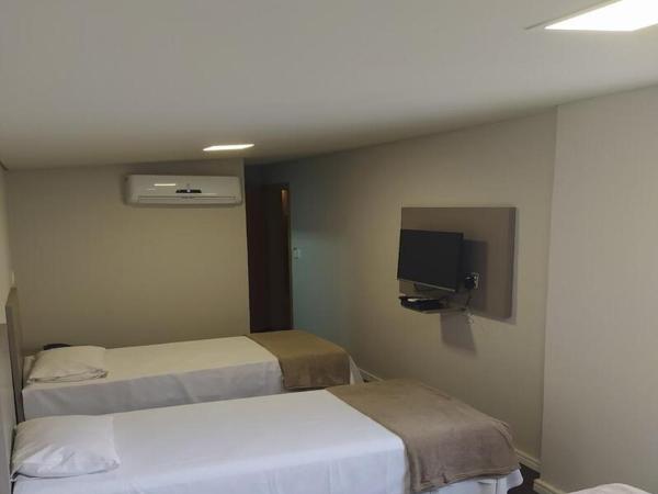 Front Hotel Expominas : photo 2 de la chambre chambre triple