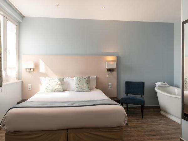 Hôtel de la Plage : photo 3 de la chambre chambre double supérieure - vue sur ville/jardin