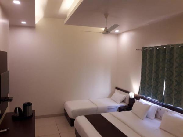 Hotel Paradise inn : photo 3 de la chambre chambre triple de luxe