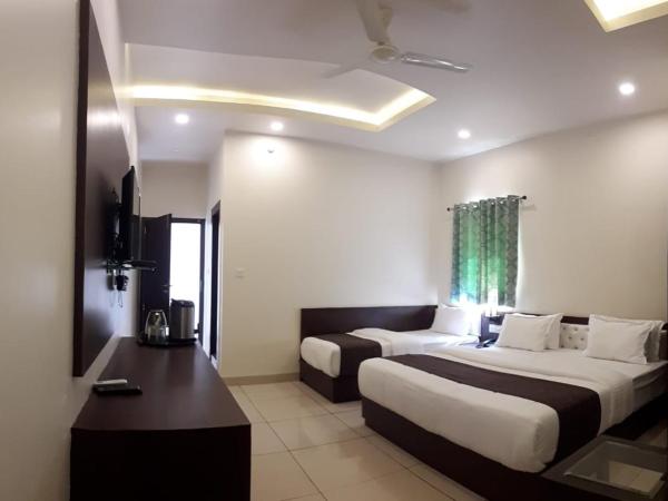 Hotel Paradise inn : photo 1 de la chambre chambre triple de luxe