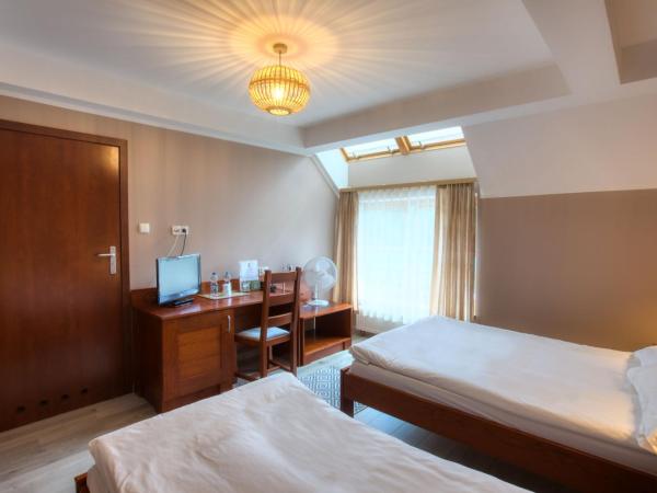 Dom Oliwski : photo 1 de la chambre chambre lits jumeaux