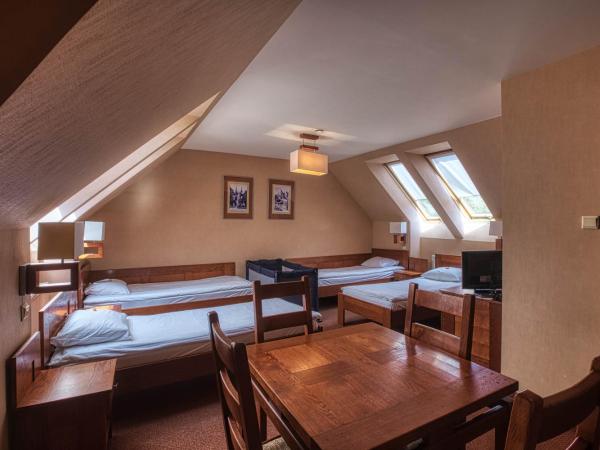 Dom Oliwski : photo 1 de la chambre chambre quadruple