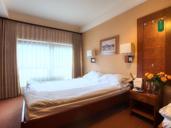 Dom Oliwski : photo 3 de la chambre chambre triple avec lit double