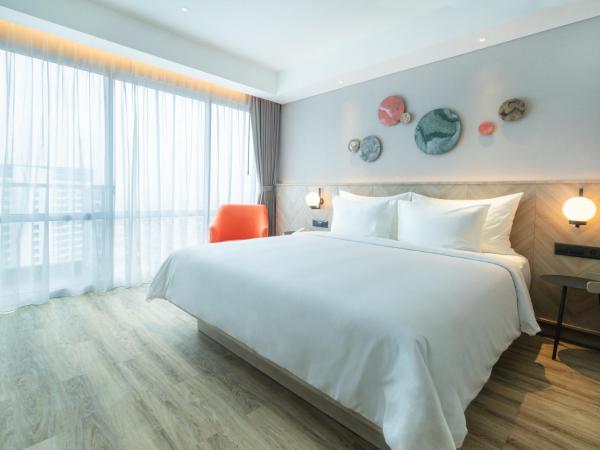 Harris Suites Puri Mansion : photo 4 de la chambre chambre double ou lits jumeaux