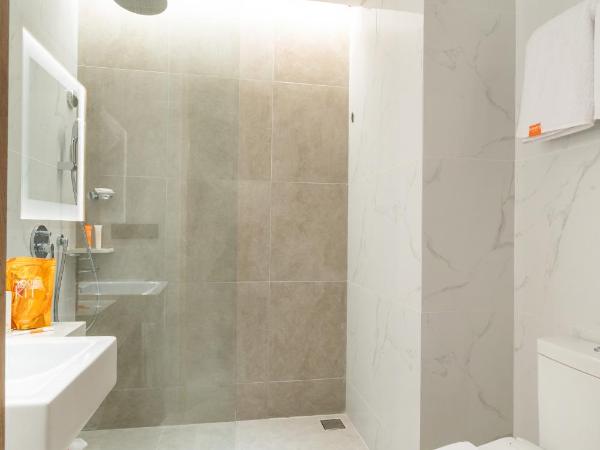 Harris Suites Puri Mansion : photo 1 de la chambre chambre double ou lits jumeaux