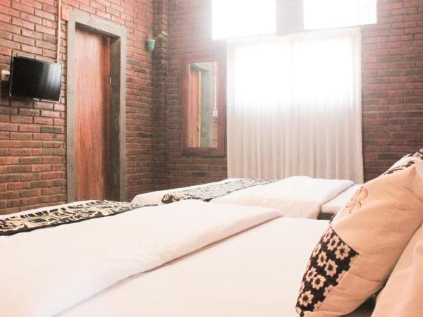 nDalem Joglo Krawitan Syariah : photo 3 de la chambre suite familiale