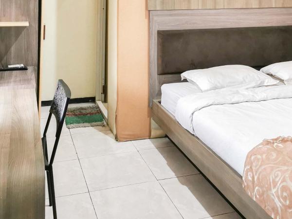 My Hommy Homestay Mitra RedDoorz : photo 7 de la chambre chambre double standard