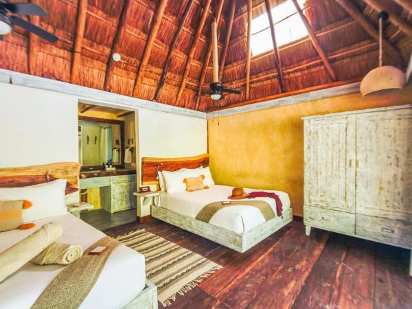 Villa Pescadores Tulum : photo 6 de la chambre chambre double - vue sur jardin