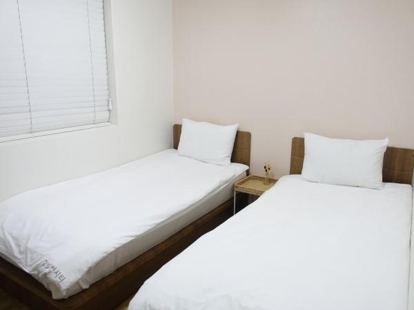 Gangnam Suncity Guesthouse : photo 2 de la chambre chambre lits jumeaux