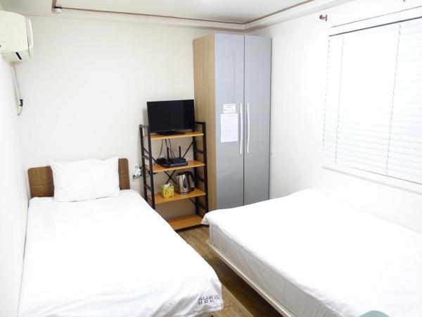 Gangnam Suncity Guesthouse : photo 4 de la chambre chambre lits jumeaux