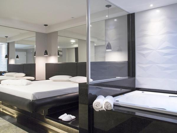 BAMBINA HOTEL -Adultos Somente : photo 1 de la chambre suite lit queen-size avec baignoire spa