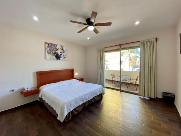 La Lola Hotel & Suites : photo 2 de la chambre suite deluxe avec lit king-size