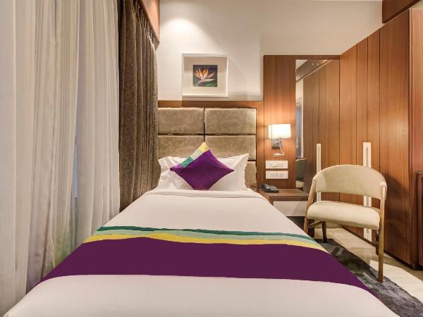 Treebo Premium Tahoora International : photo 3 de la chambre [sanitized] single room