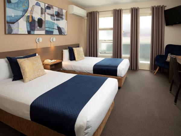 The Metropolitan Spring Hill : photo 1 de la chambre hébergement lits jumeaux metro