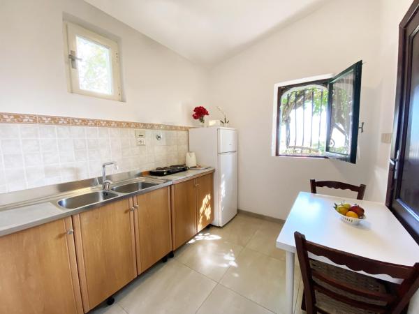 Residence Terra Rossa Taormina : photo 7 de la chambre studio avec patio et vue sur la mer