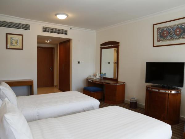 The Palace Hotel - فندق القصر : photo 2 de la chambre chambre lits jumeaux deluxe